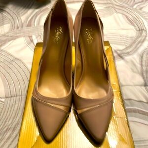 Nude 3 1/2 inches heel. Never been worn.